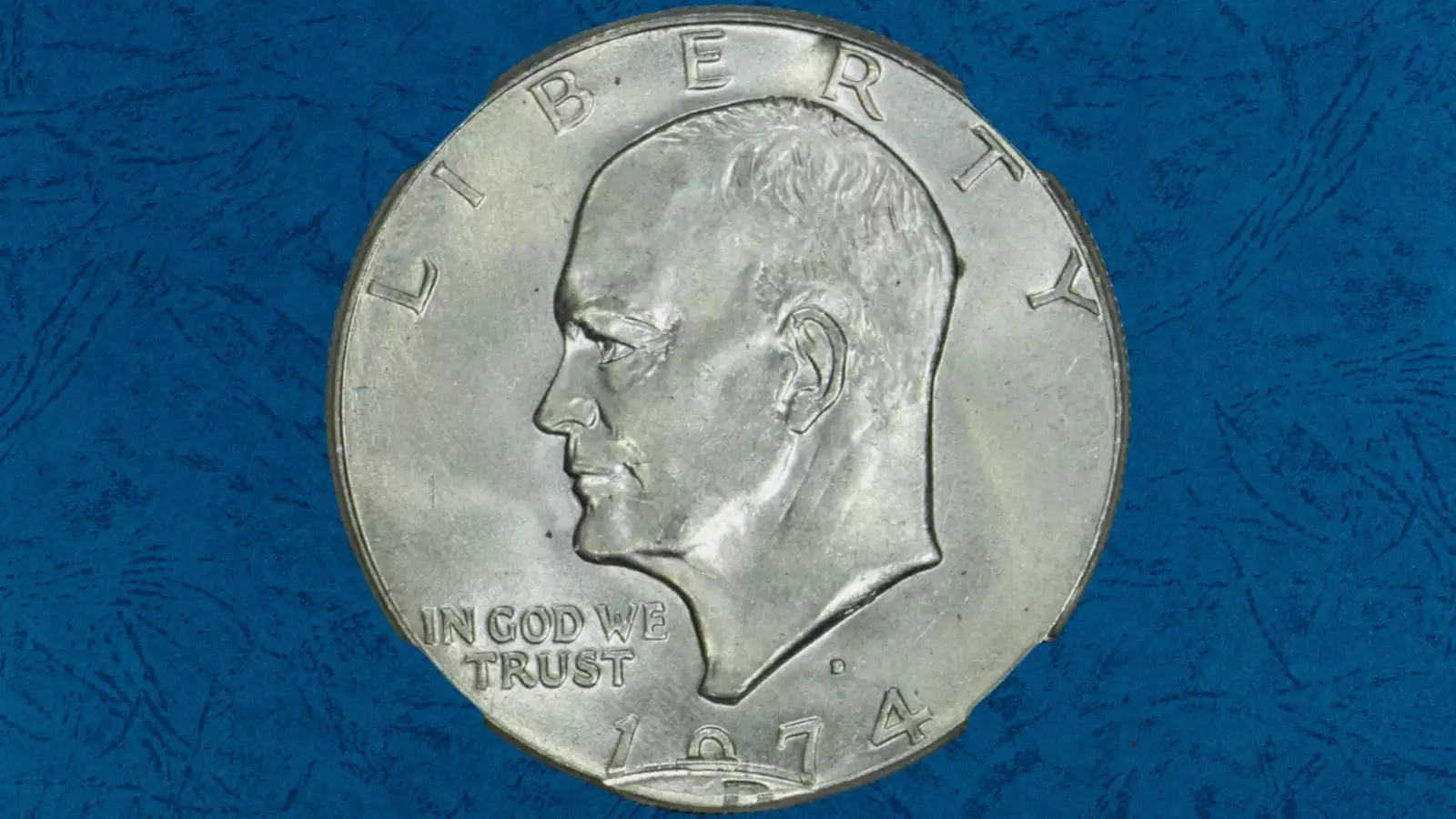 1974 Eisenhower dollar off-center strike error showing design shifted with blank planchet crescent visible